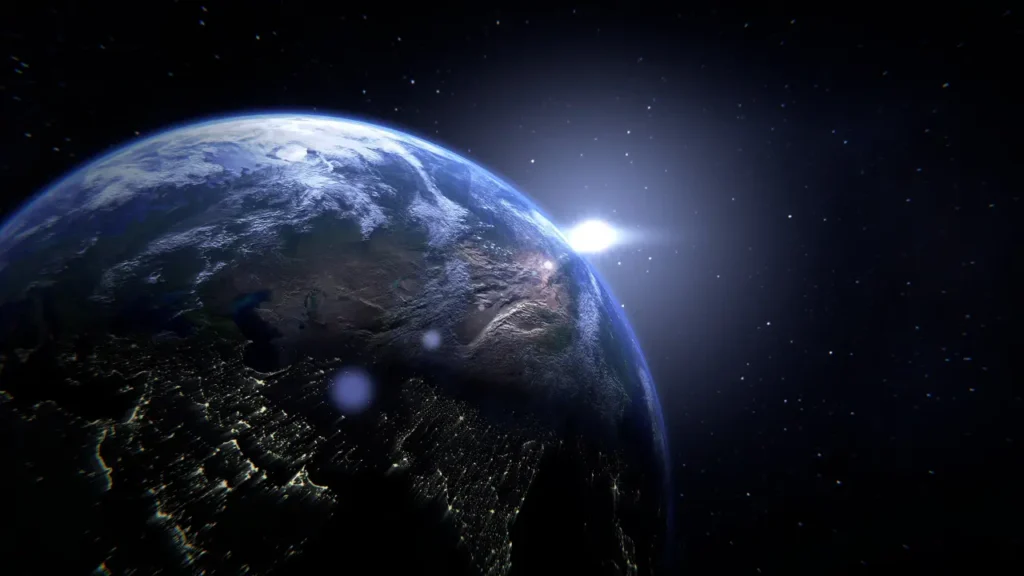 Earth seen from space with sunrise in the background