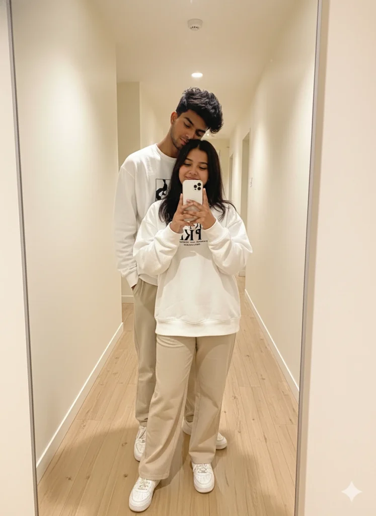 Couple taking a mirror selfie in matching outfits, inspired by Gemini AI Romantic couple photo prompts.