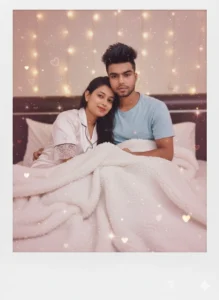 Couple cuddling in bed with warm fairy lights, inspired by Gemini AI Romantic Gemini Couple Photo.