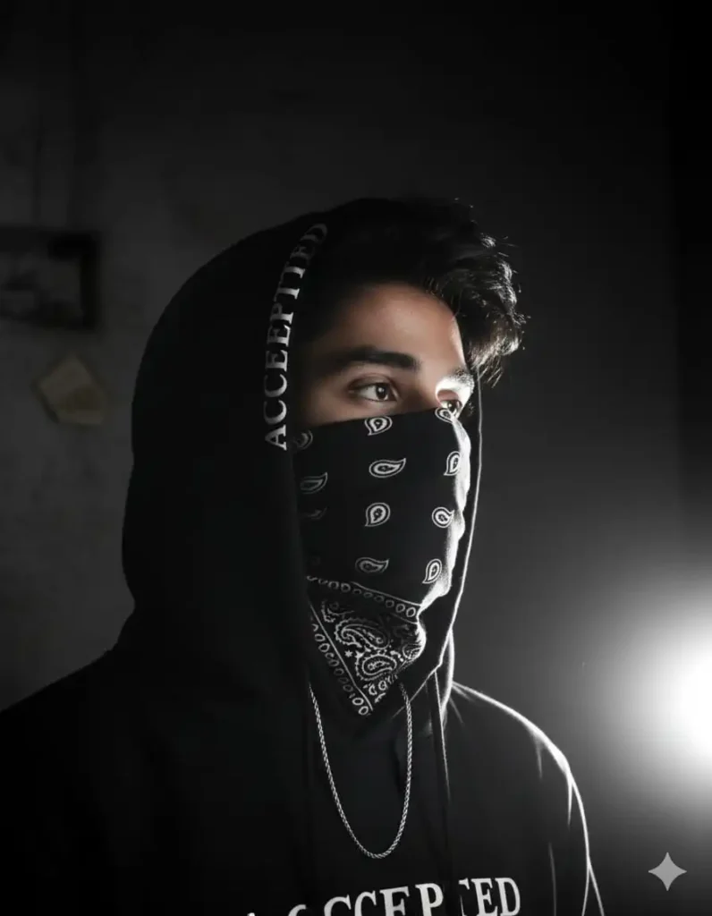 A cinematic masked portrait of a young man wearing a black hoodie and bandana, created using gemini Masked AI photo Prompt.