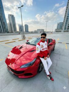 Boy posing with a red Ferrari on a rooftop with city skyline – trending gemini ai photo prompt copy paste for boy