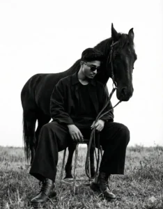 Dark Aesthetic Aura Farming AI Photo Prompts featuring a black and white cinematic portrait of a man standing confidently with a black horse