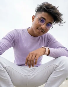 Google Gemini Low Angle Portrait AI Photo Editing Prompt for Boys showing a confident young man shot from below eye level with a clean sky background