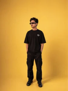 studio style ai photo boy yellow background black outfit sunglasses modern look