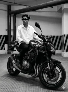 Kawasaki Z900 motorcycle prompt for boy in a cinematic underground parking with dramatic lighting