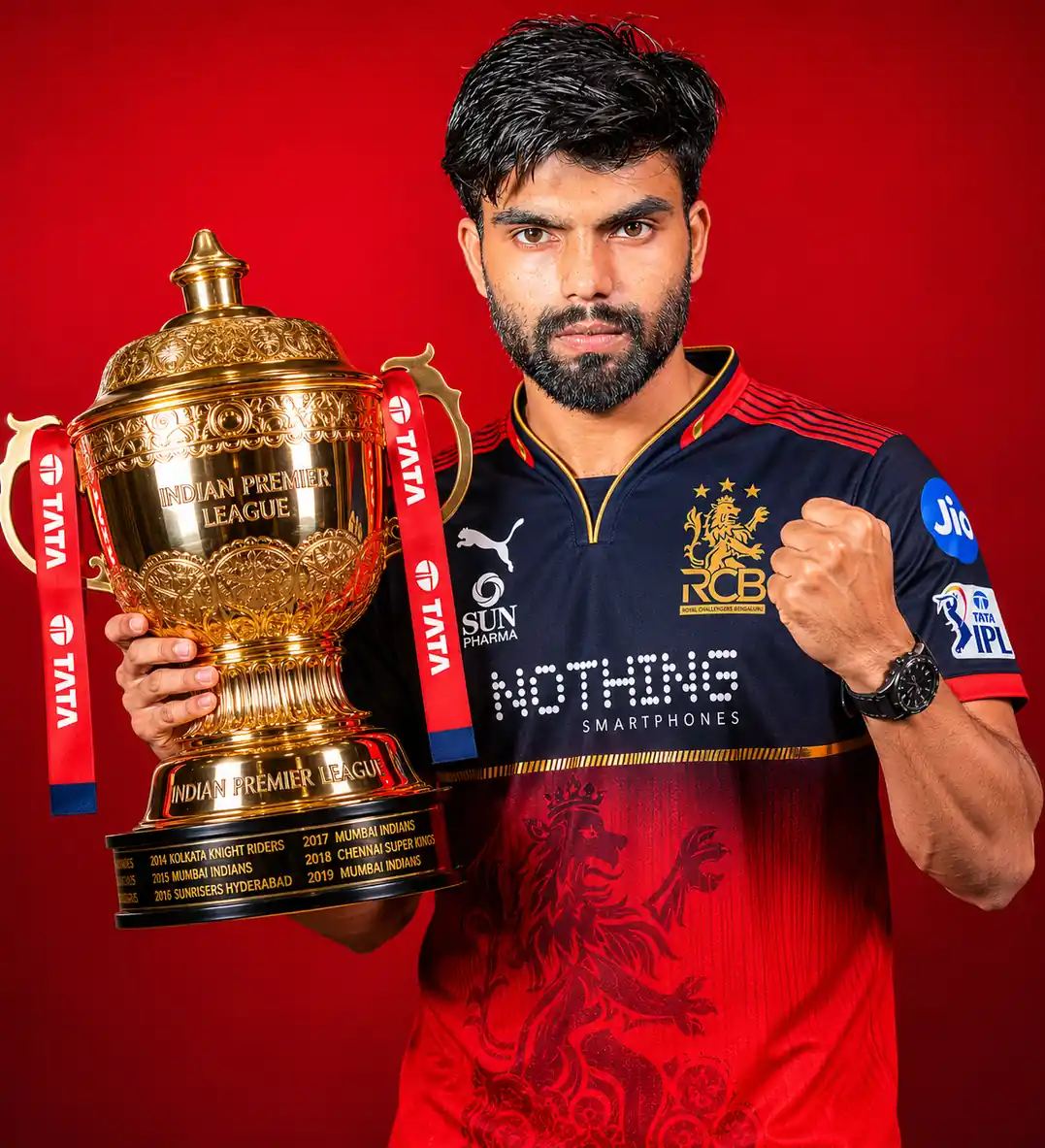 Victory shout pose RCB Prompt
RCB winning IPL trophy AI photo prompt with Royal Challengers Bengaluru player holding trophy and celebrating victory