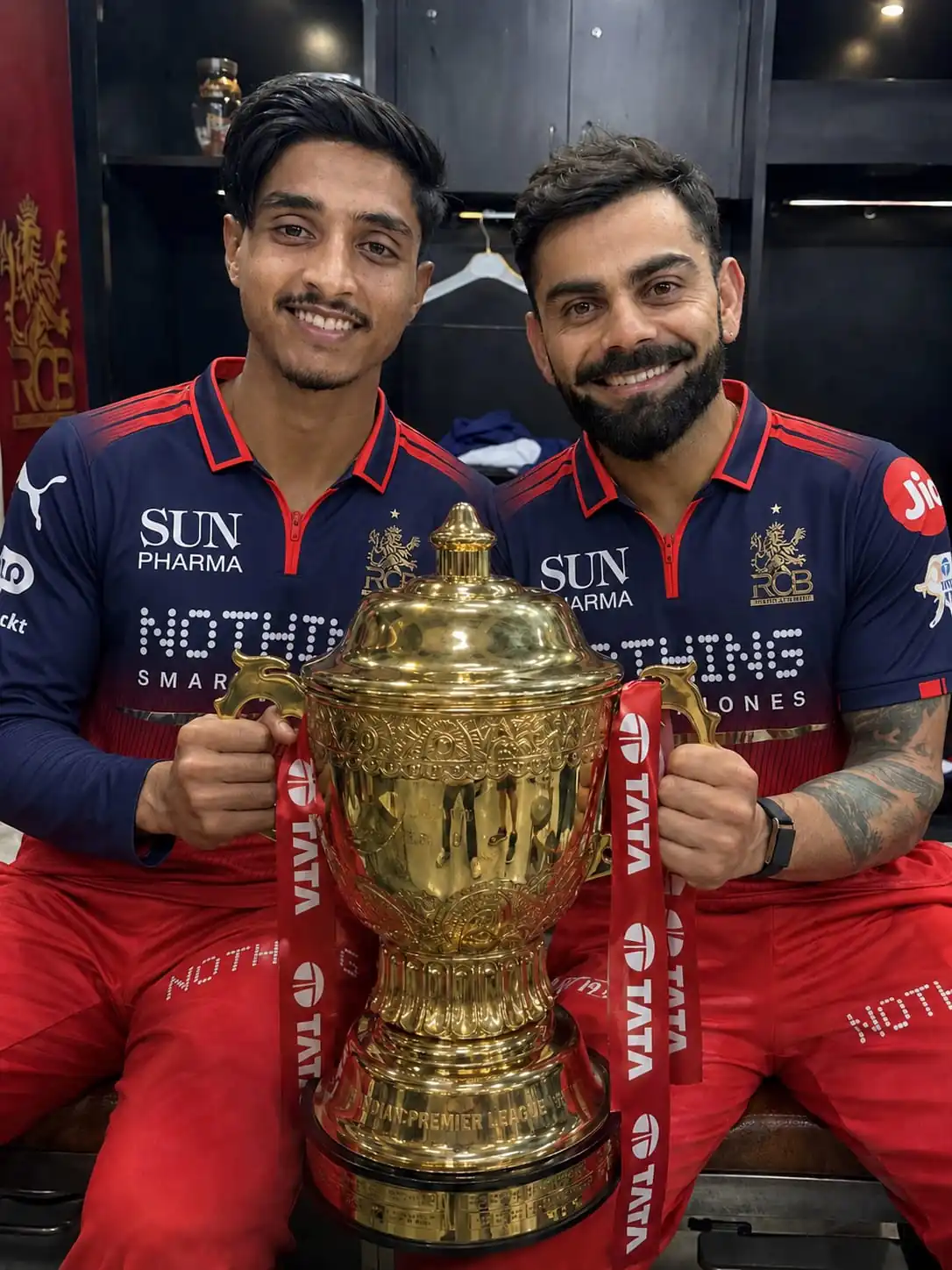 RCB IPL 2026 AI photo of Virat Kohli AI Photo Prompt with a young fan holding the Indian Premier League trophy inside locker room